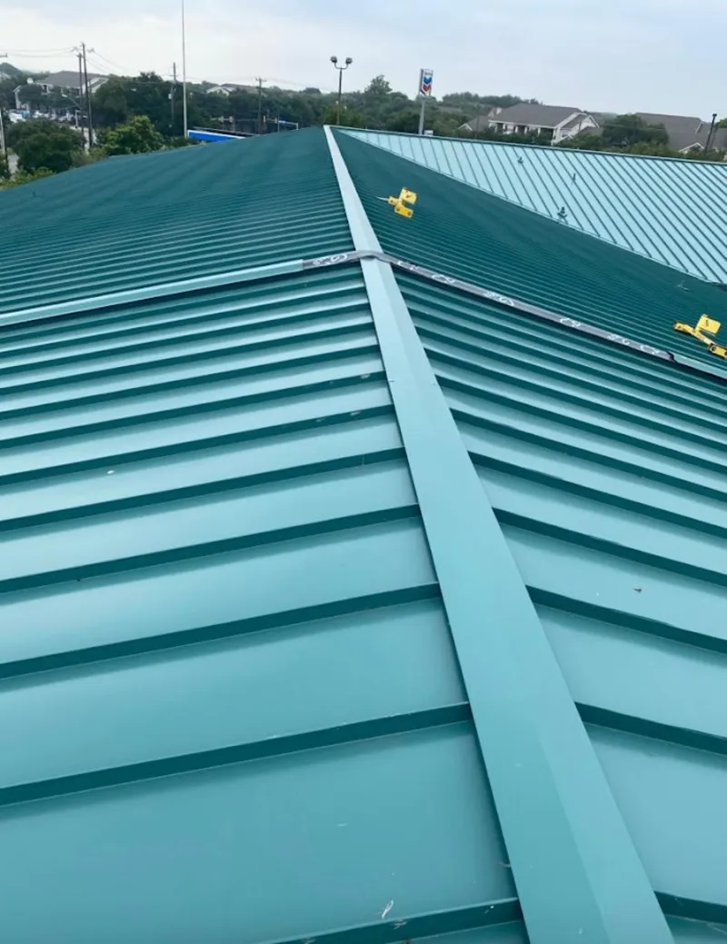 Green commercial metal roof ridge and valley for Metal Roof Repair in Hooksett